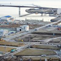 Land damaged by the March 2011 tsunami is still clearly visible in Ishinomaki, Miyagi Prefecture, on Feb. 12, nearly five years after the quake and tsunami. | SATOKO KAWASAKI