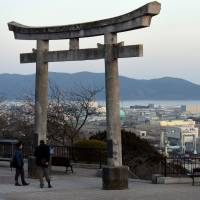 The port of Ishinomaki is seen from Hiyoriyama Park, located in the center of the city in Miyagi Prefecture, on Feb. 12. | SATOKO KAWASAKI