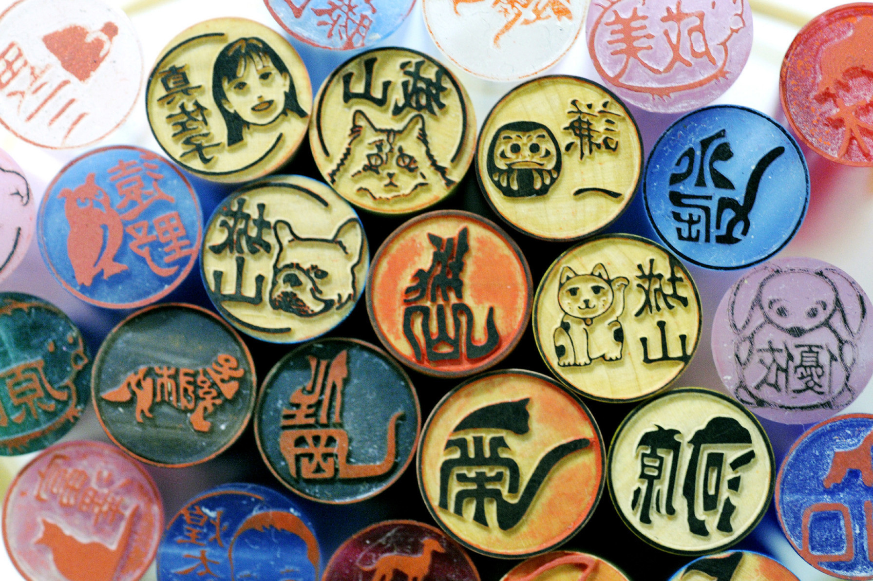 Cheeky chops: Hanko run the gamut from light-hearted novelty seals like these to the Privy Seal of Japan, which is wielded by the Emperor and hewn from pure gold, and the Great Seal of Japan, which is affixed to treaties, state documents and the like. | KYODO