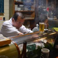The master and the matriarch: Tiny family-run restaurant Ajikyu is located along a quiet residential street north of Kyoto\'s nightlife district. | J.J. O\'DONOGHUE