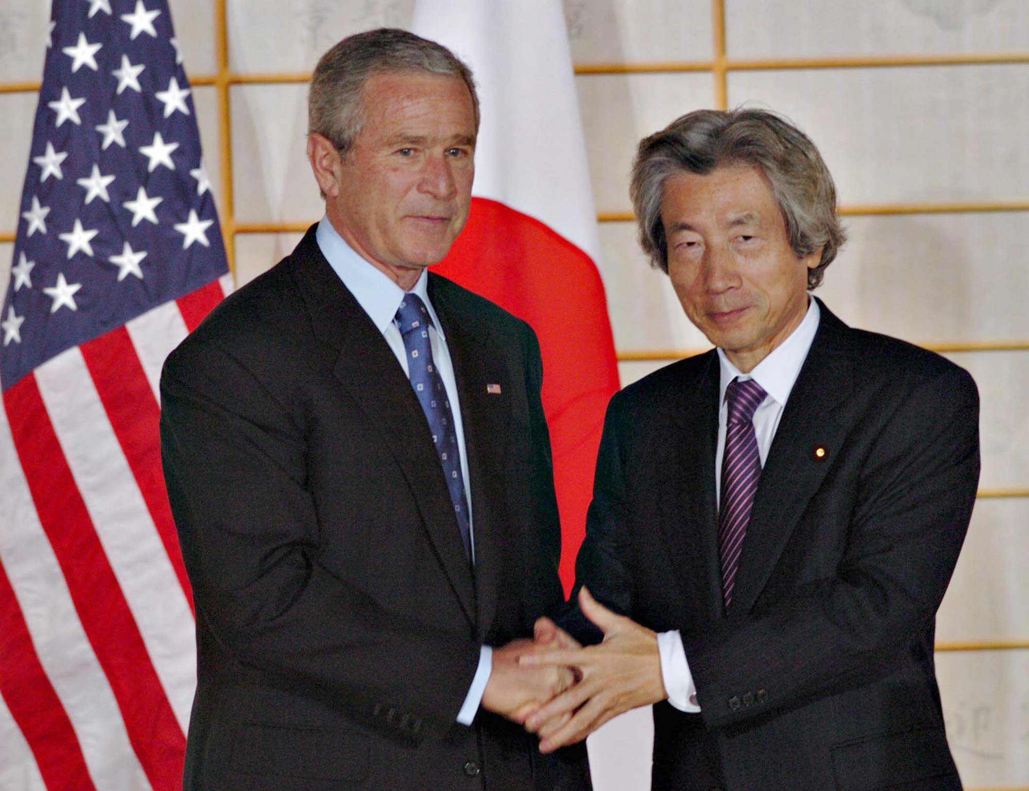 Old ways: Former U.S. President George W. Bush and Prime Minister Junichiro Koizumi meet in Kyoto in 2005. The two leaders' cooperation on the issue of the 'war on terror' led to some acts of protest in Japan. | BLOOMBERG NEWS