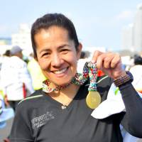 Martha Canto, Accountant, 48 (Mexican): This marathon was so  beautiful. The people were  so nice and polite. I love this  city. Compared to Chicago  or Berlin, the course was  not so easy, as it has some  hills, so it is a more complex marathon to run. But I have reached my target now,  as this is my sixth World Marathon Major, so I am  very happy. | ISTOCK