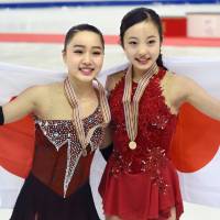 Wakaba Higuchi (left) and Marin Honda placed third and first, respectively, at the world junior championships last weekend in Debrecen, Hungary. | KYODO