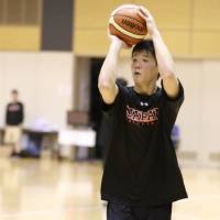 Yudai Baba works on his shooting during a mini training camp for the provisional Japan men\'s national team on Tuesday at the National Training Center. | KAZ NAGATSUKA