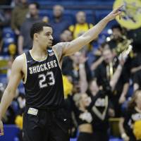 Wichita State’s Fred VanVleet gestures to fans during the Shockers’ win over Vanderbilt during the NCAA Tournament on Tuesday. Wichita St. tops Vandy in First Four