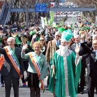 Thousands of people decked out in green attire parade through the streets of Tokyo\'s Omotesando district Sunday as part of the third annual I Love Ireland Festival in celebration of St. Patrick\'s Day. | YOSHIAKI MIURA