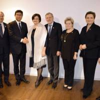 Reconstruction minister Tsuyoshi Takagi (third from left) shakes hands with the Speaker of the Lithuanian parliament Loreta Grauziniene at a reception in her honor at the Lithuanian Embassy on March 2. They were joined by (from left) Andrius Kubilius, former Lithuanian prime minister; Egidijus Meilunas, ambassador of Lithuania; Gediminas Kirkilas, former Lithuanian prime minister; Lithuanian parliament members Irena Siauliene and Dangute Mikutiene; and Minister of Energy Rokas Masiulis. | LITHUANIAN EMBASSY