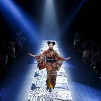 A model presents a creation by Jotaro Saito from the designer\'s Autumn/Winter 2016 collection during Mercedes-Benz Fashion Week Tokyo on Wednesday. | REUTERS