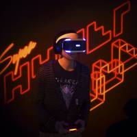 Game developer Marc Flury plays Kokoromi\'s Superhypercube on Sony\'s PlayStation VR during an event in San Francisco on Tuesday. | REUTERS