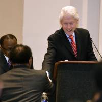 Former President Bill Clinton is greeted as he arrives to give an address to the General Conference of the African Methodist Episcopal Church meeting in Philadelphia Thursday. | CLEM MURRAY / THE PHILADELPHIA INQUIRER VIA AP