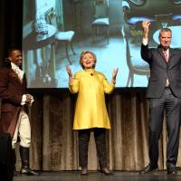 Leslie Odum Jr. (left) from the Broadway musical \"Hamilton,\" presidential candidate Hillary Clinton and New York City Mayor Bill de Blasio perform Saturday at the 94th annual Inner Circle Dinner in New York. Clinton and de Blasio have come under fire over their comedy skit at the show that some people feel was racially insensitive. Many in the room where it happened, which was filled with New York politicians, power brokers and reporters, laughed at the joke. But it soon made its way around social media and drew some scornful media coverage. | DAVID HANDSCHUH / THE INNER CIRCLE VIA AP, FILE