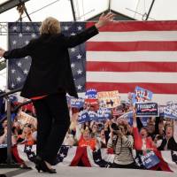 Democratic presidential candidate Hillary Clinton walks on stage during a rally in Syracuse, New York, on Friday. | AP