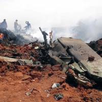 A general view shows the wreckage of a government warplane after Nusra Front repotedly shot it down over the northern Syrian town of Al-Eis on Tuesday and captured one crew members, a rebel source and the Syrian Observatory for Human Rights said. Syria regime forces wage counteroffensive to oust Nusra Front from village near Aleppo