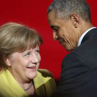 U.S. President Barack Obama and German Chancellor Angela Merkel attend the official opening ceremony of the Hanover industry Fair at the Hannover Congress Center HCC in Hanover, Germany, Sunday. | AFP-JIJI