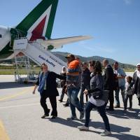 A group of Syrian refugees arrive to board a plane with Pope Francis on Saturday at the airport of Mytilene, on the Greek island of Lesbos. AFP-JIJI Pope returns with 12 refugees after visit to Greek camp