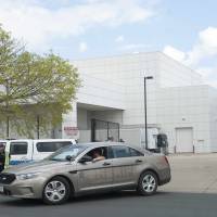 A sheriff\'s car leaves Paisley Park, music superstar Prince\'s estate in Chanhassen, Minnesota, on April 21. Authorities in Minnesota obtained a search warrant in connection with the death of pop star Prince and also won a court order to keep the findings secret, documents showed Thursday. | REUTERS