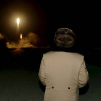 North Korean leader Kim Jong Un watches the ballistic rocket launch drill of the Strategic Force of the Korean People\'s Army (KPA) at an unknown location, in this undated file photo released by North Korea\'s Korean Central News Agency (KCNA) in Pyongyang on March 11. | FILES / KCNA / REUTERS