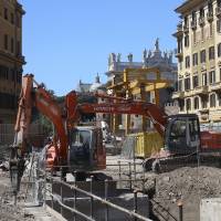 Excavators work at the site of a metro railway tunnel under construction near St. John Lateran Basilica in Rome on April 11. | REUTERS