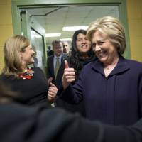 Democratic presidential candidate Hillary Clinton gives a thumbs-up during a tour of the Corsi senior center Friday in New York. | AP