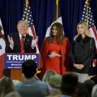 U.S. Republican presidential candidate Donald Trump speaks as his wife, Melania, daughter Ivanka and Ivanka\'s husband, Jared Kushner, listen at a campaign rally on caucus day in Waterloo, Iowa, on Feb. 1. | REUTERS