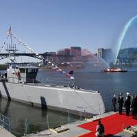 The autonomous ship Sea Hunter, developed by DARPA, is shown docked in Portland, Oregon, after its christening ceremony Thursday. | REUTERS