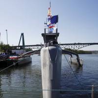 The autonomous trimaran Sea Hunter, developed by DARPA, is shown docked in Portland, Oregon, after its christening ceremony Thursday. | REUTERS