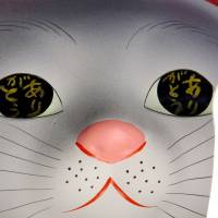 \"Arigato\" (\"thank you\") is written in the eyes of a maneki neko (beckoning cat) figure displayed at Gotokuji Temple in Setagaya Ward, Tokyo, on March 12. | YOSHIAKI MIURA