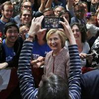 Democratic U.S. presidential candidate Hillary Clinton greets attendees at her New York presidential primary rally in the Manhattan borough of New York City on Tuesday evening. | REUTERS
