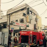 The Tokyo Fire Department dispatched more than 30 firetrucks to battle the blaze in Golden Gai, which started on the first floor of an old building at about 1:30 p.m. | ANDREW LEE