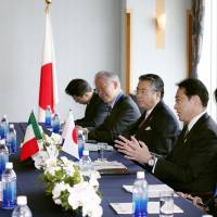 Italian Foreign Minister Paolo Gentiloni (left) and Foreign Minister Fumio Kishida (right) hold talks in Hiroshima Sunday on the sidelines of a two-day Group of Seven foreign ministers\' meeting, which started the same day. | POOL/KYODO