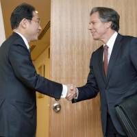 Foreign Minister Fumio Kishida greets U.S. Deputy Secretary of State Antony Blinken in Tokyo on Monday. | KYODO