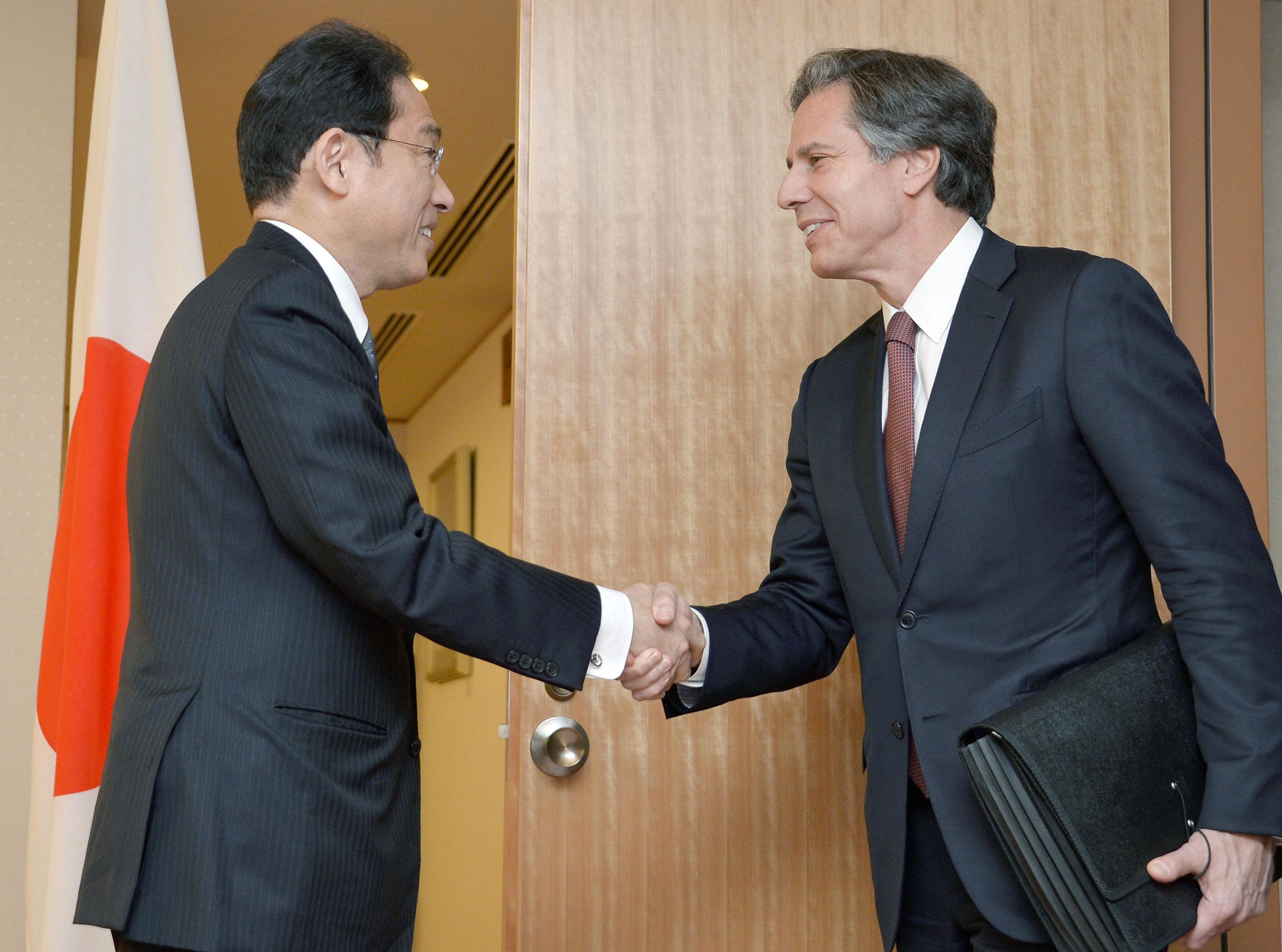 Foreign Minister Fumio Kishida greets U.S. Deputy Secretary of State Antony Blinken in Tokyo on Monday. | KYODO