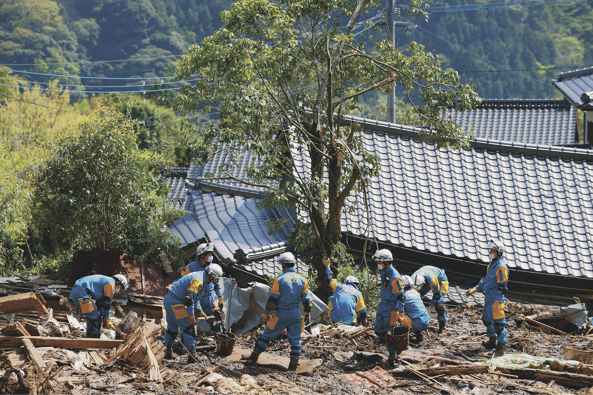Police officers from Osaka engage in search and rescue operations in the village of Minamiaso, Kumamoto Prefecture, on Saturday.  | KYODO