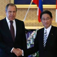 Russian Foreign Minister Sergei Lavrov meets with Japanese counterpart Fumio Kishida in Tokyo on Friday. | AFP-JIJI