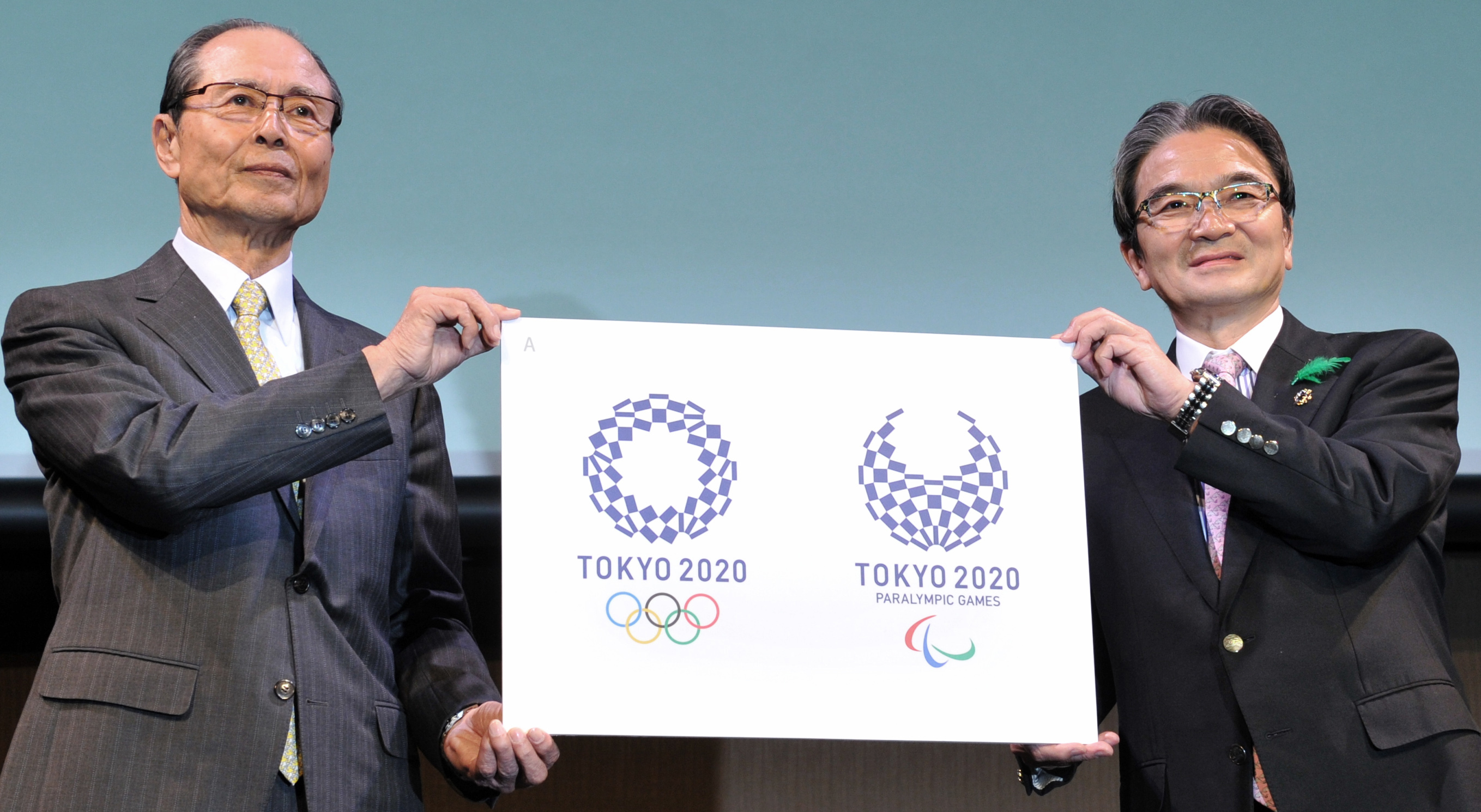 Baseball legend Sadaharu Oh (left) and Logo Selection Committee Chairman Ryohei Miyata announce the official emblems for the Tokyo 2020 Olympic and Paralympic Games during a ceremony in Tokyo on Monday. | YOSHIAKI MIURA