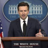 White House press secretary Josh Earnest speaks Tuesday during his daily news briefing at the White House in Washington. | AP