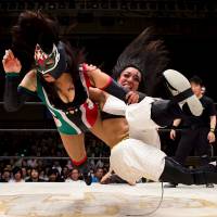 Wrestlers Kris Wolf and Starfire fight during their Stardom professional wrestling show at Korakuen Hall in Tokyo in July 2015. | REUTERS