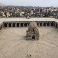 A panoramic view of Cairo, as seen from the Mosque of Ahmed Ibn Tulun’s exterior stone staircase. Finding serenity in an ancient Cairo mosque