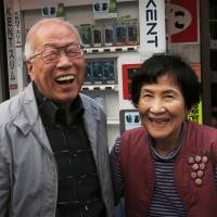Happy pair: Tobacco shop owner Teruyo Mitate and architectural photographer Motonari Sato both live in a Tokyo neighborhood of nagaya (wooden row houses). You don't know what you've got (till it's gone) in Tokyo's nagaya
