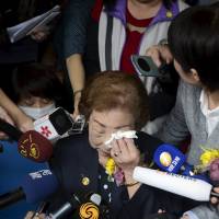 Remembering the past: Former \"comfort woman\" Chen Lien-hua wipes tears as she speaks to the media during a ceremony unveiling the nameplate of a museum dedicated to Taiwan\'s comfort women on March 8, International Women\'s Day, in Taipei. | REUTERS