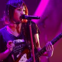 <em>Anisong</em> (anime song) and rock singer LiSA performs live at Makuhari Messe Hall in Chiba last December. Anime biz sings the praises of shows