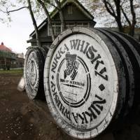 Casks bearing the Nikka Whisky Co. logo sit at the company\'s distillery in Yoichi, Hokkaido, in May 2012. | BLOOMBERG
