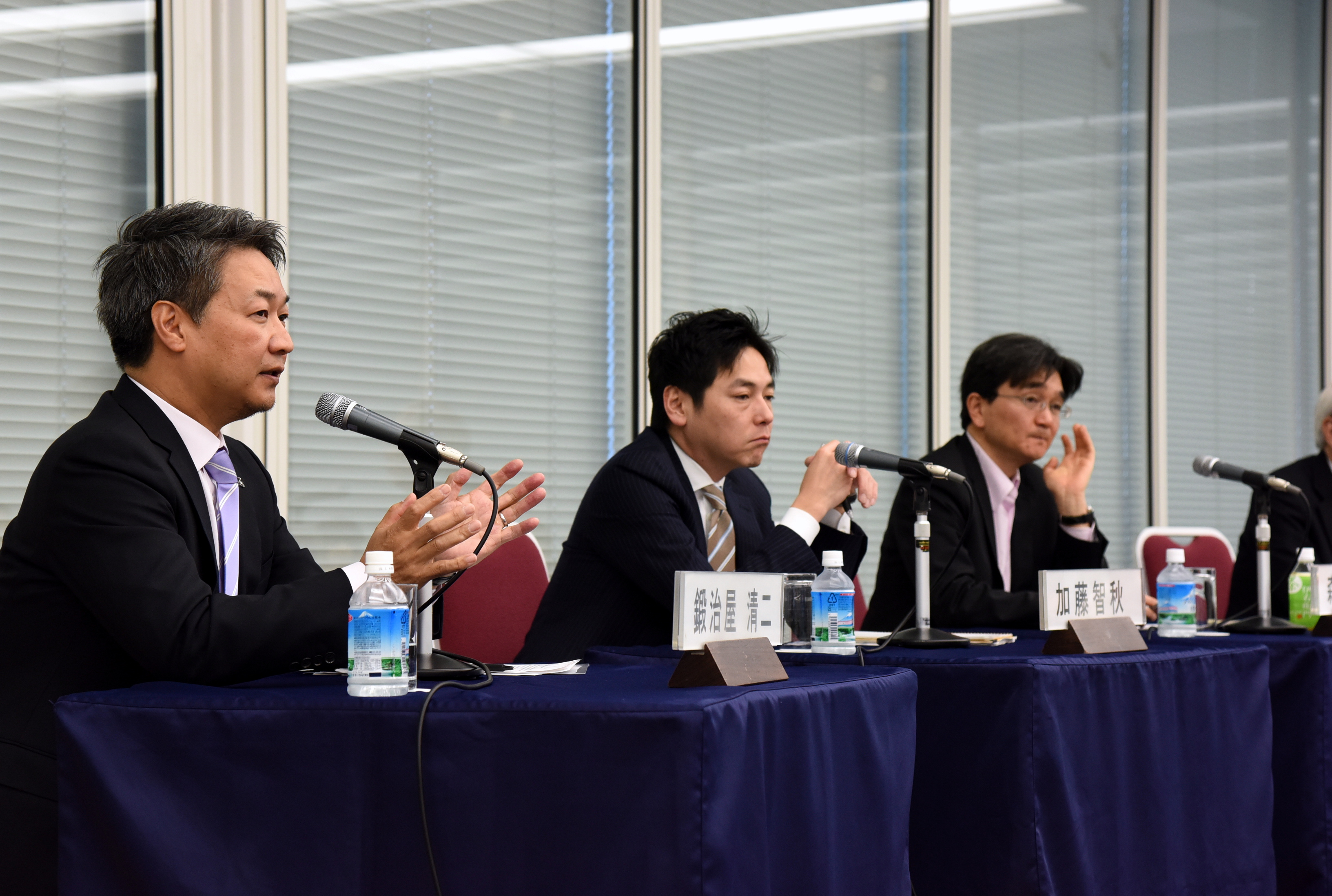 From left: Dassault Systemes K.K. Managing Director Seiji Kajiya, McKinsey &amp; Company's Chiaki Kato and the University of Tokyo's Hiroyuki Morikawa answer questions from a moderator and audience members at a symposium organized by the Keizai Koho Center, titled 'The Future of Industry (Industry 4.0) and Japan's Economic Growth,' in Tokyo on March 18. | SATOKO KAWASAKI