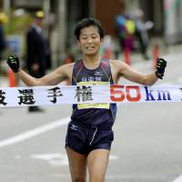 Takayuki Tanii crosses the line to win the 50-km walk national title on Sunday in Wajima, Ishikawa Prefecture. | KYODO