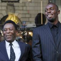 Jamaican sprinter Usain Bolt (right) poses with Brazilian soccer legend Pele at a sponsor\'s event in New York on Tuesday. | REUTERS