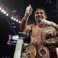 Manny Pacquiao gestures to fans after his victory over Timothy Bradley on Saturday in Las Vegas. Pacquiao beats Bradley via unanimous decision