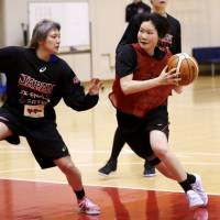Guard Manami Fujioka (right) drives on Asami Yoshida during a practice session for the Japan women\'s national team on Tuesday. | KAZ NAGATSUKA