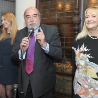 Argentine Ambassador Raul Dejean (second from right) is flanked by his wife Teresa (right) and  daughter Mariangeles (second from left) as he speaks at a farewell reception at the ambassador\'s residence on March 30. | YOSHIAKI MIURA