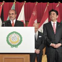 Prime Minister Shinzo Abe (second from right) looks on as Palestine representative in Japan and Dean of the Arab Diplomatic Corps Waleed Siam (second from left) speaks to mark the eighth Arab Week reception and in celebration of Arab-Japan friendship. | YOSHIAKI MIURA