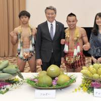 Thai Ambassador Bansarn Bunnag (second from left) and the Director of the Tourism Authority of Thailand, Tokyo Office Pattaraanong Na Chiangami (right) pose with Muay Thai fighters at a press conference announcing the 2016 Thai Festival (May 14-15 at Tokyo\'s Yoyogi Park) at the Japan National Press Club on April 26. | YOSHIAKI MIURA